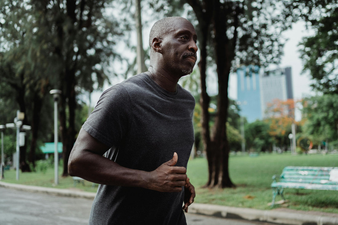 Man over 40 exercising outdoors to boost metabolism and improve energy